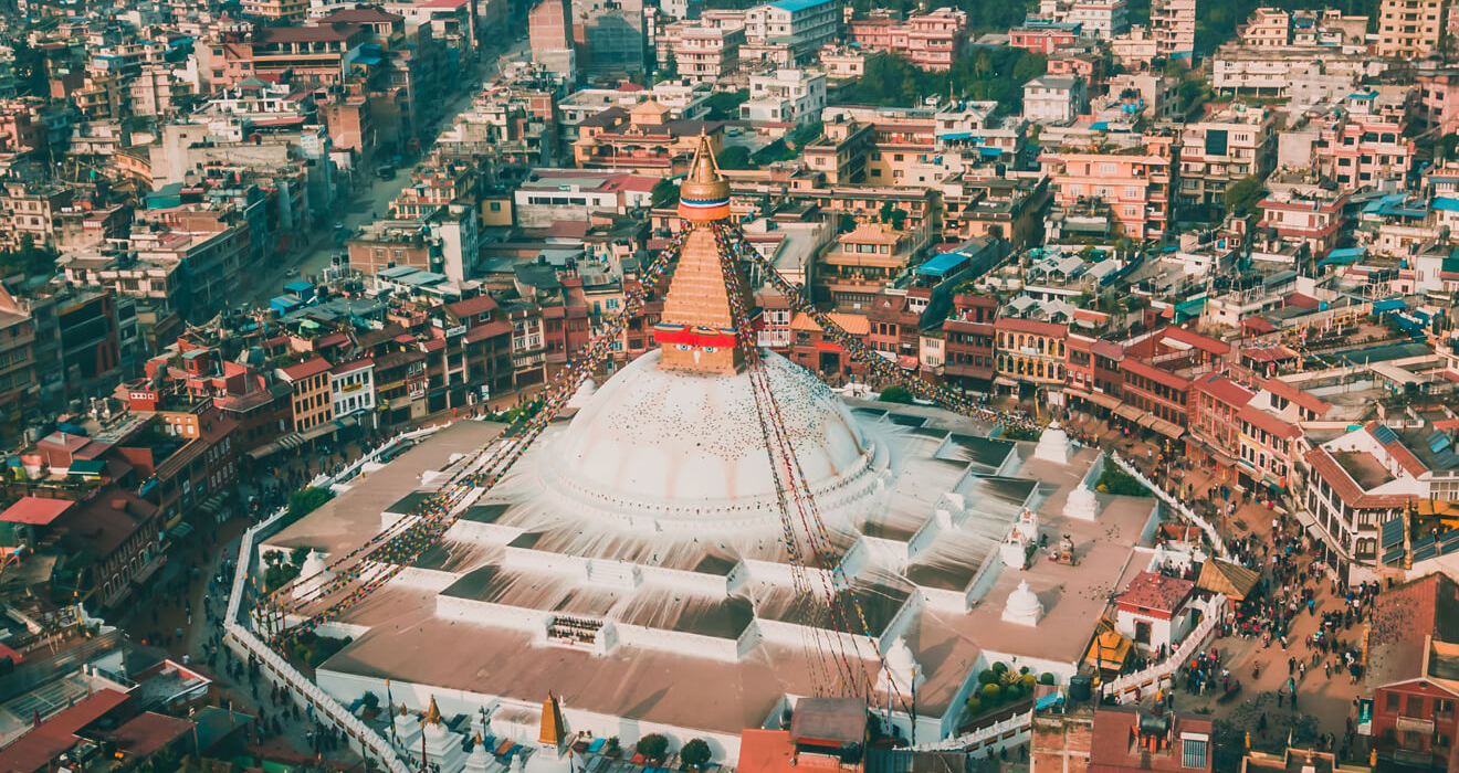 Boudhanath Stupa and its surrounding urban landscape in Kathmandu Valley
